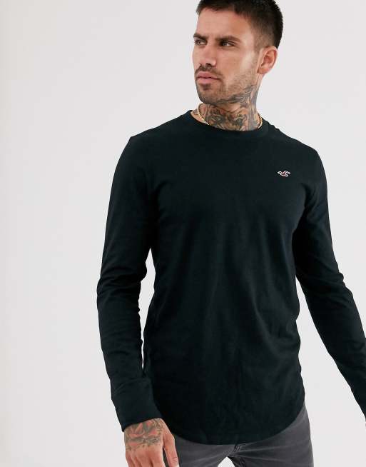 Hollister - Top a maniche lunghe con fondo arrotondato e logo nero