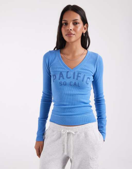 Hollister top grafico a maniche lunghe con scollo a V blu, 1 di 4