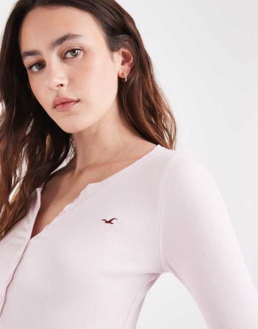 Hollister top henley à manches longues à logo icon en rose bébé, 1 de 4