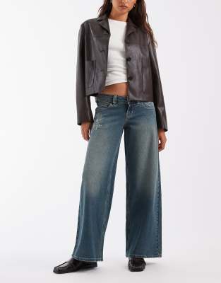 Hollister ultra low rise baggy fit jeans with embroidery detail in dark blue wash