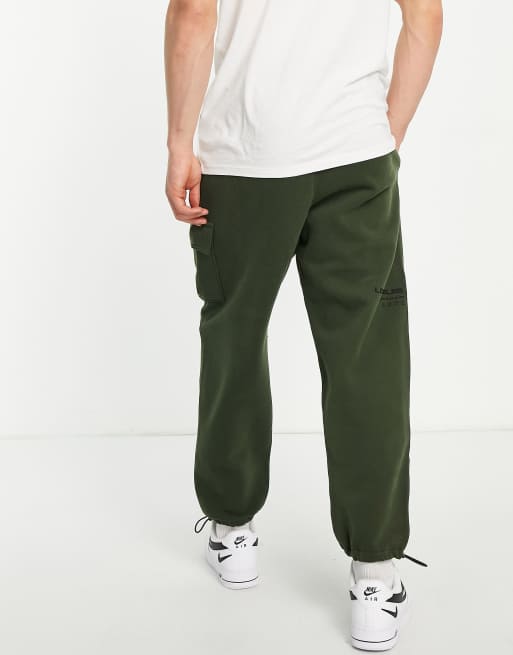 Hollister Print Logo Camo Print Skinny Joggers In Olive Green Camo, $32, Asos