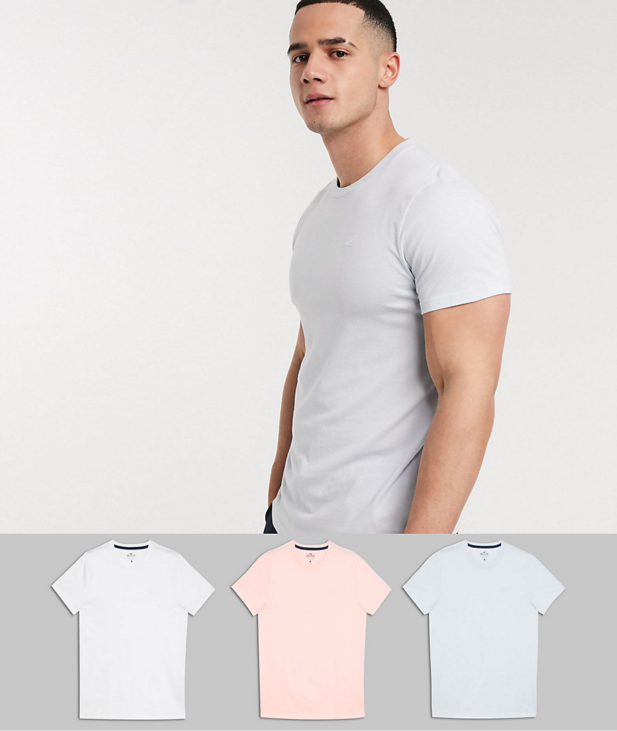Hollister – Vit/ljusblå/persikofärgad t-shirt i 3-pack med rund halsringning och fiskmåslogga Exklusiva-Flerfärgad