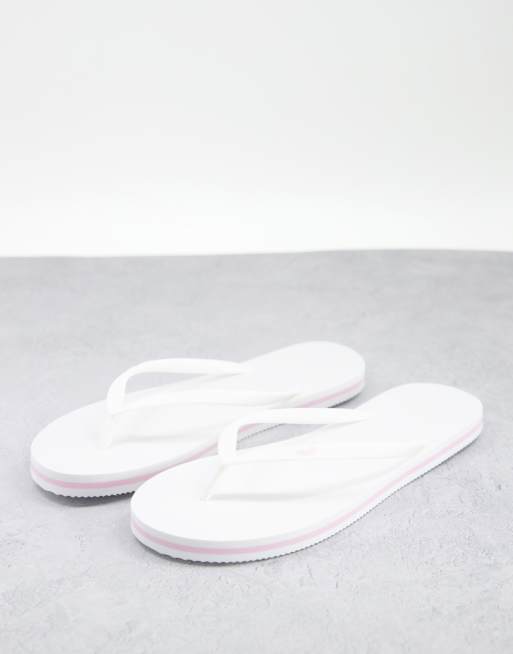 Hollister – Vita flip flops med logga