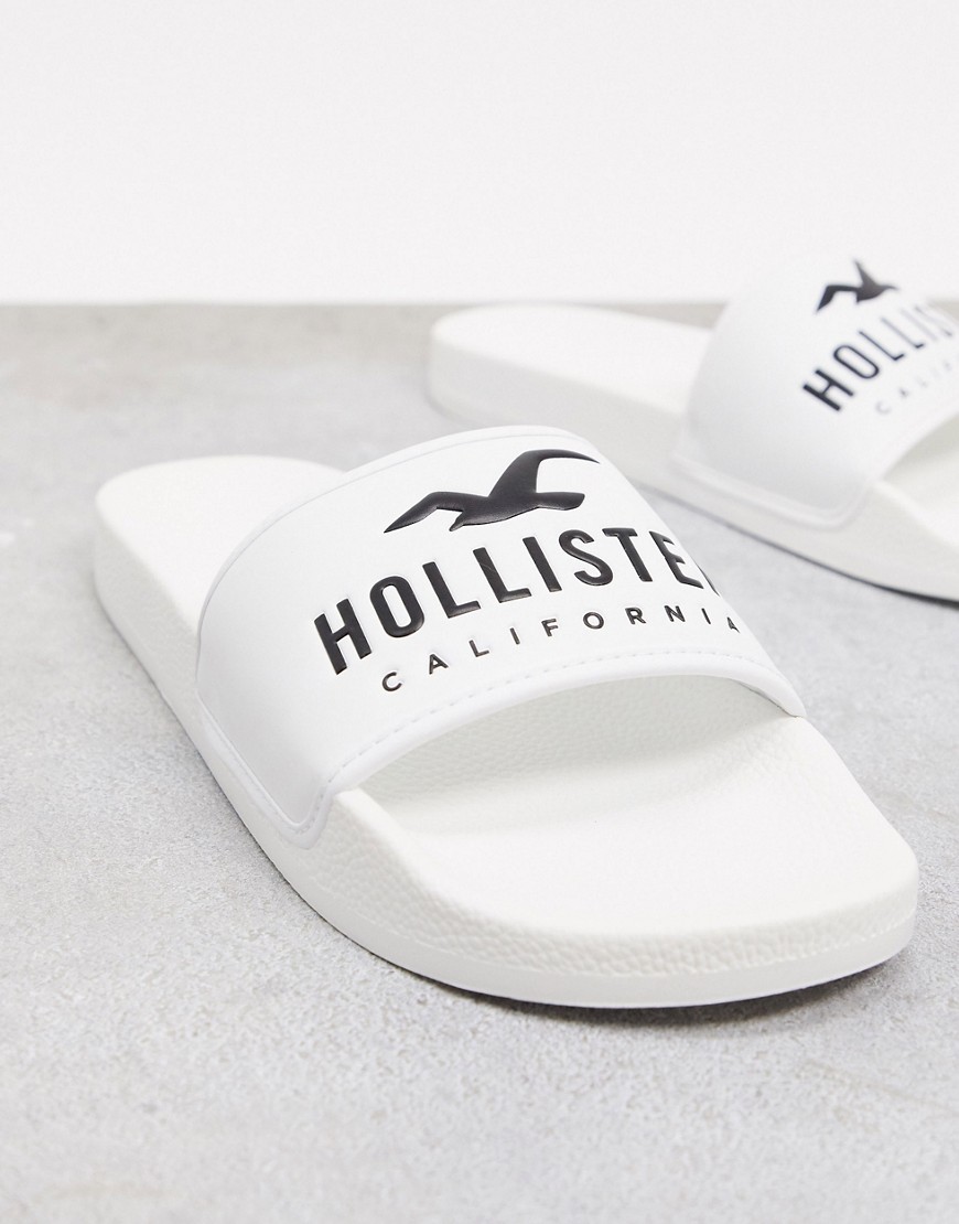 Hollister – Vita tofflor med logga