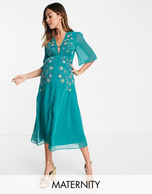 Hope & Ivy Maternity - Nette midi jurk in smaragdgroen versierd met sterren