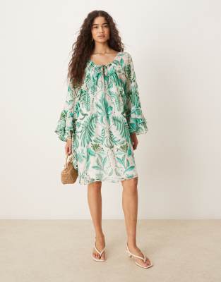 tie neck frill sleeves mini dress in green palm print