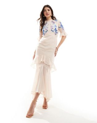 tiered maxi dress with lace trim in blush pink with blue contrast embroidery