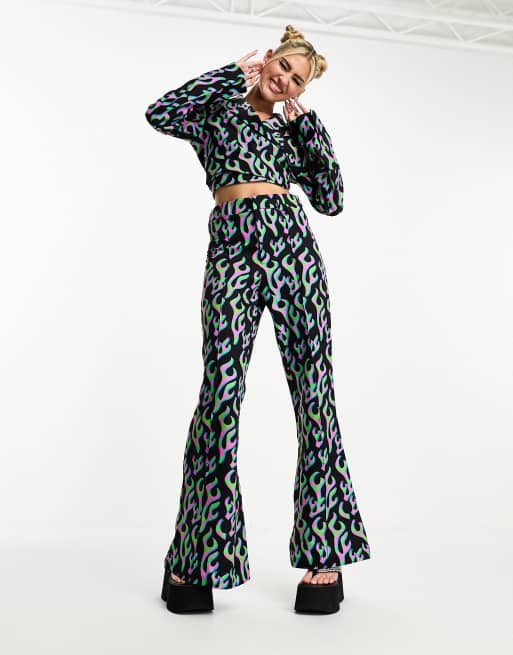 House of Holland suit flared pants in green and pink flame print