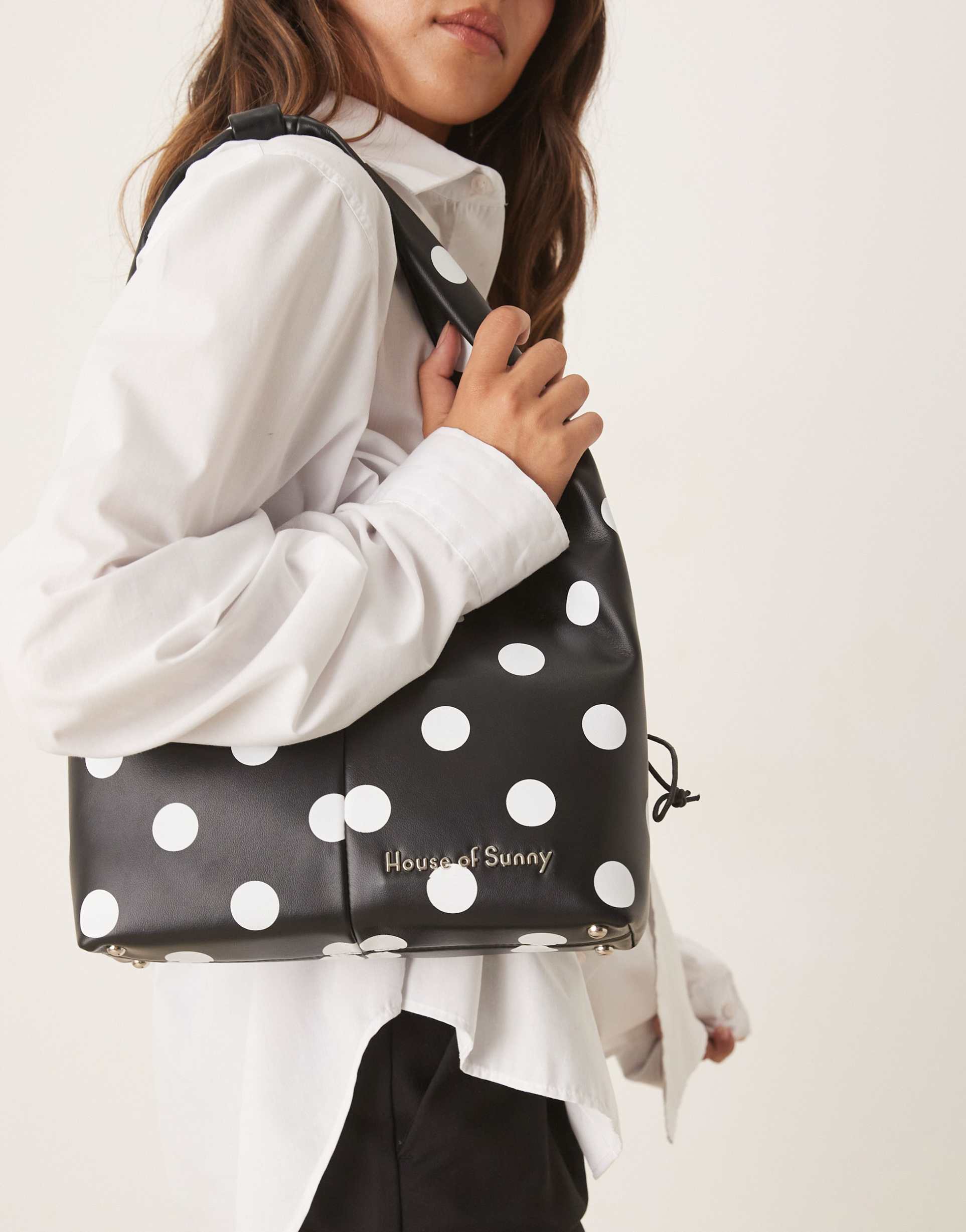 house of sunny polka dot sling bag in black