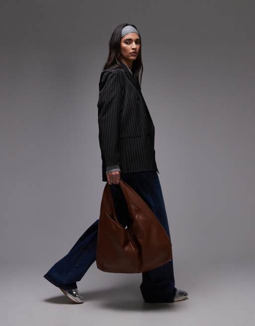 House of Sunny the big sling faux leather bag in brown | ASOS