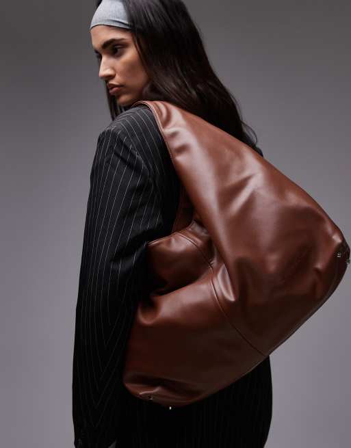 House of Sunny the big sling faux leather bag in brown | ASOS