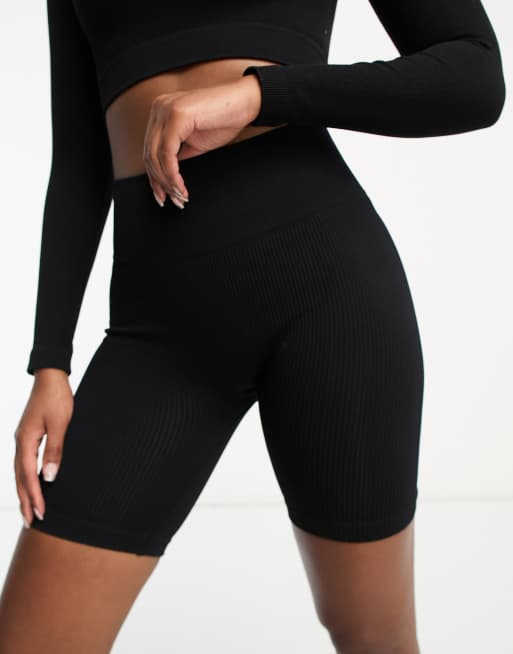 Hoxton Haus - Naadloze fitness-leggingshort in zwart