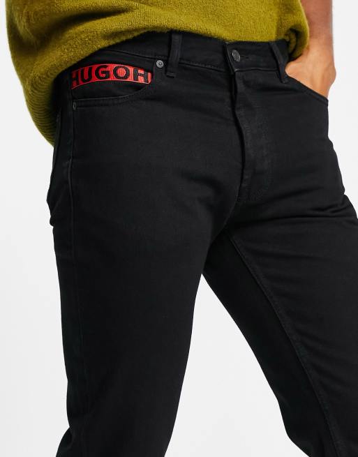 HUGO – 634/3 – Schmal zulaufende Jeans in Schwarz, 3 von 4
