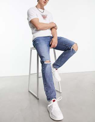 HUGO 634 distressed knees tapered fit jeans in mid blue - ASOS Price Checker