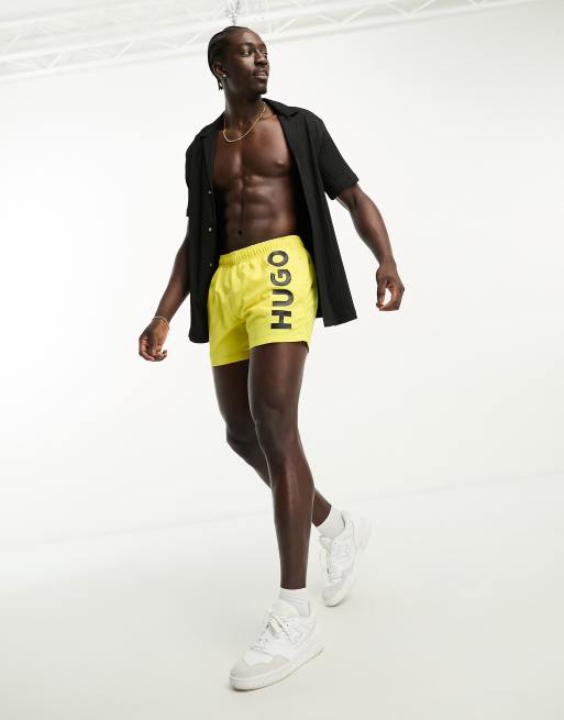 Bright yellow swim shorts online