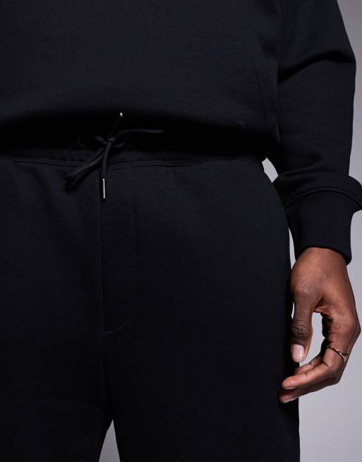 HUGO Blue loose fit jersey shorts in black with pink logo (part of a set)