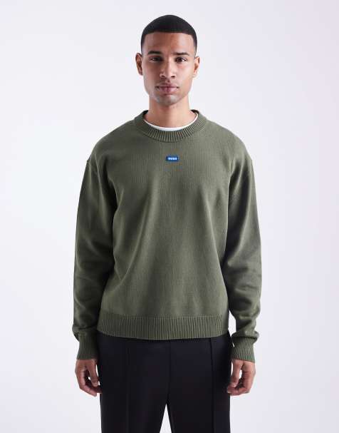 HUGO Blue – San Casey – Locker geschnittener Strickpullover in Dunkelgrün mit mittigem Logo - view 1