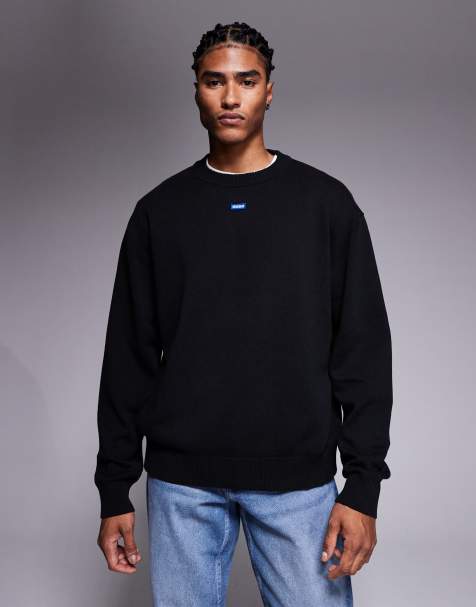 HUGO Blue – San Casey – Relaxed-Fit-Strickpullover in Schwarz mit mittigem Logo - view 1