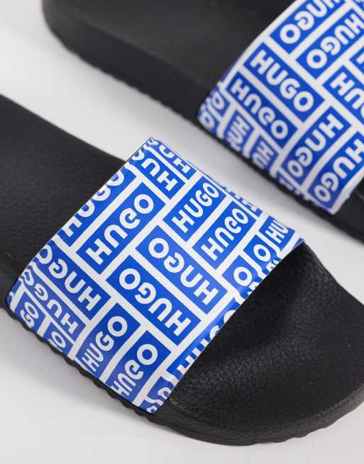 Hugo Blue Timein logo sliders in blue and black, 3 of 4