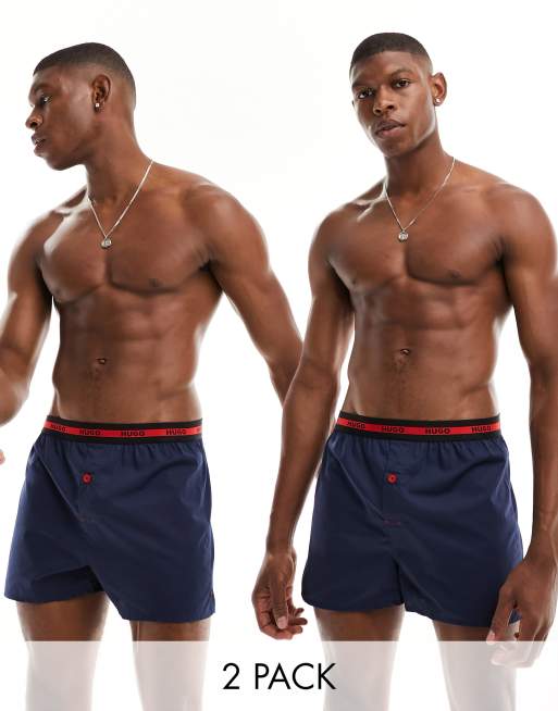 Tommy Hilfiger woven boxer shorts with all over Tommy flag print in navy, ASOS