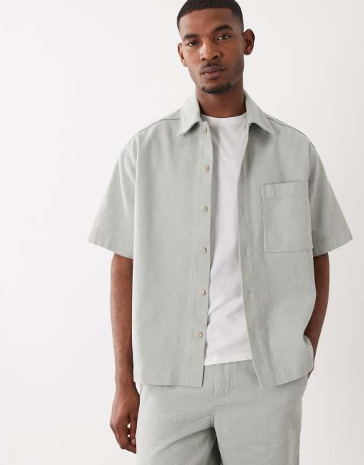Hugo Boss - Camicia a maniche corte in denim turchese con bottoni in coordinato