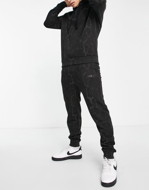 HUGO Danther joggers in black with all over animal print with back logo