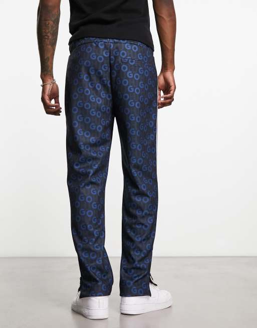 HUGO Datalas all over logo relaxed fit track pants in navy | ASOS