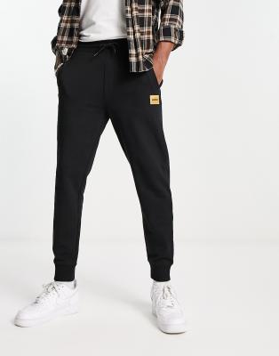 HUGO Doak regular fit gold logo joggers in black