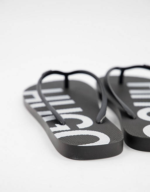 Designer Brands HUGO large contrast logo flip flops in black 