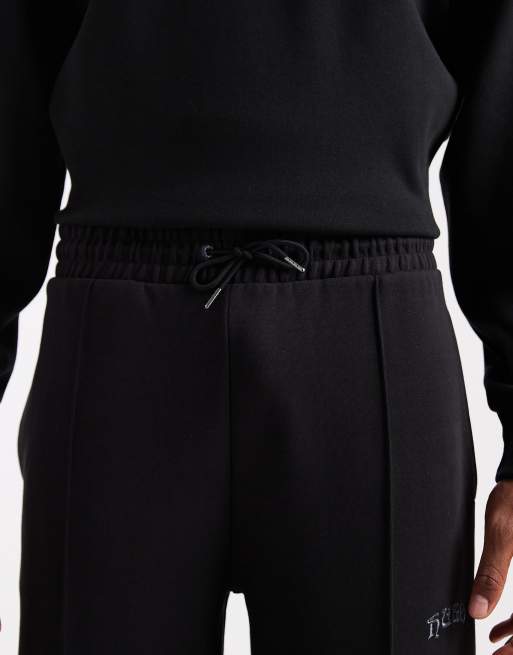 HUGO RED Dadsinolo silver logo open hem front seam sweat pants in black, 5 of 5