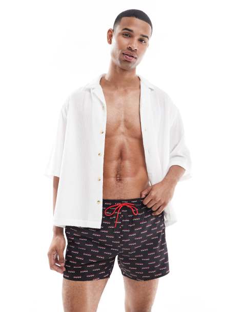 Hugo Red logo pattern shorts in black and red - view 1
