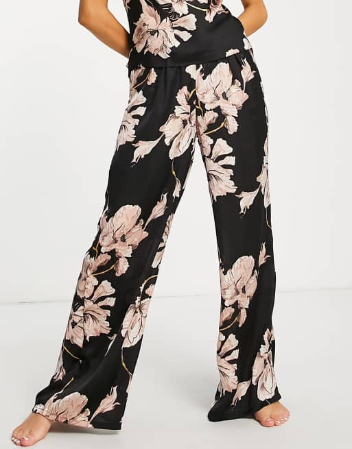 Hunkemoller - Pantaloni del pigiama in raso nero con stampa a fiori