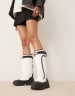 Hunter Intrepid tall buckle snow boots in white | ASOS