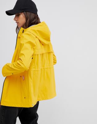 yellow rubberised rain mac