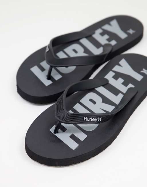 Hurley – Fast Lane – Zehenstegsandalen in Schwarz/Grau