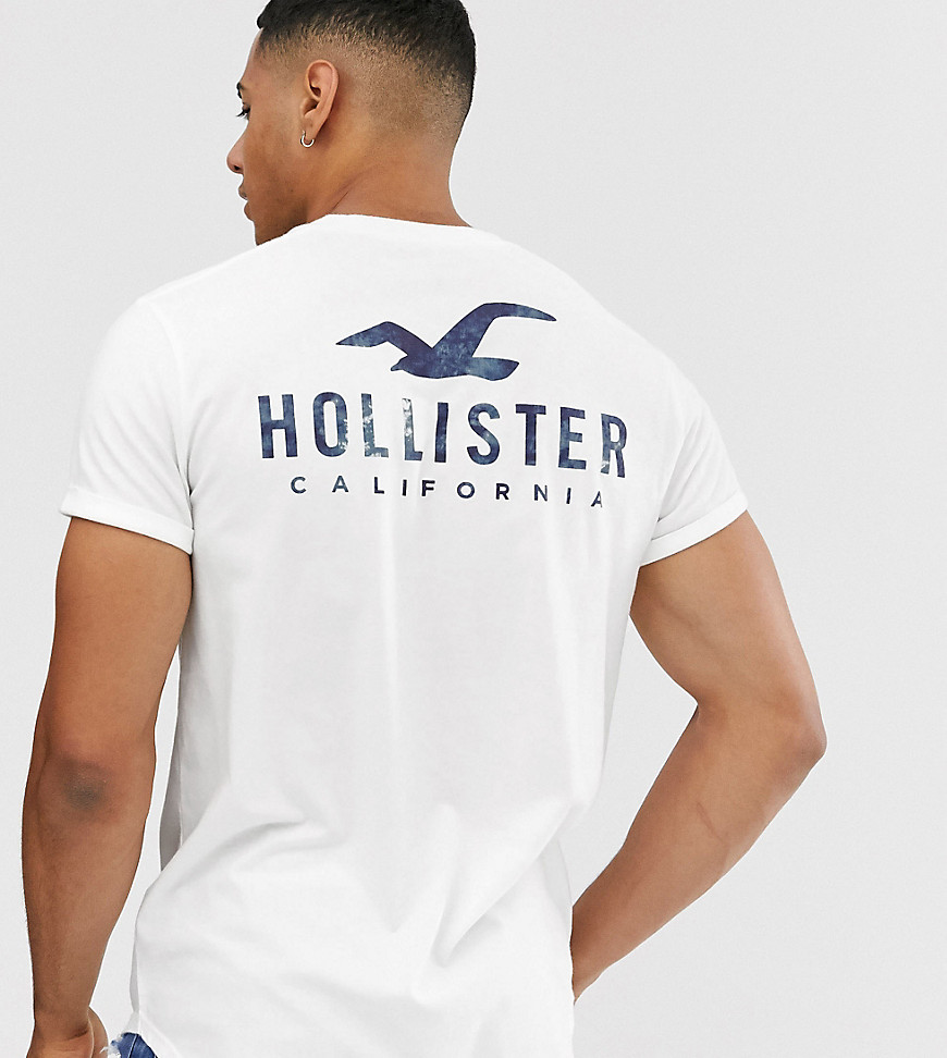 Hvid t-shirt med print af logo foran og bagpå og buet kant fra Hollister, kun hos Asos