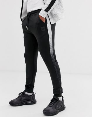 Hype - Polyester slim-fit joggingbroek met streep met spikkels-Zwart