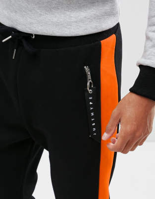 black joggers with orange stripe