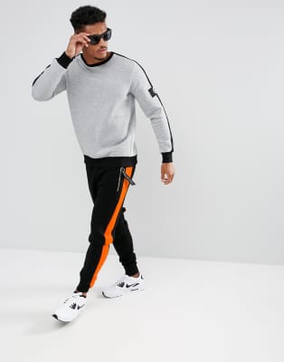 black joggers with orange stripe