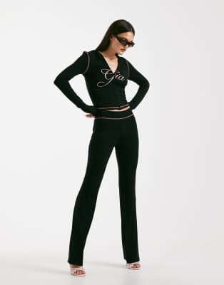 I.AM.GIA I.AM.GIA Blare logo back print contrast stitch track pant co-ord in black and pink