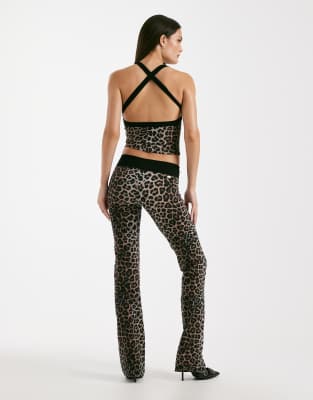 I.am.gia Blare Sculpting Slinky Contrast Crossover Waist Flared Pants In Black
