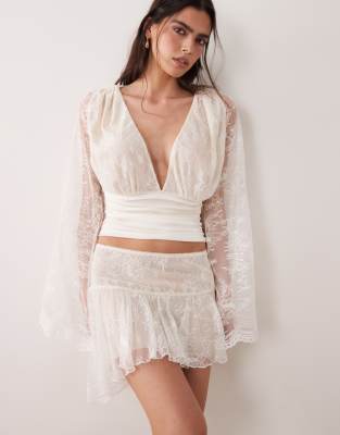 I.am.gia Stevie Lace Ruffle Dropped Waist Asymmetric Detail Mini Skirt In White