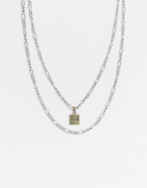 Icon Brand layered neckchains in silver with gold engraved pendant