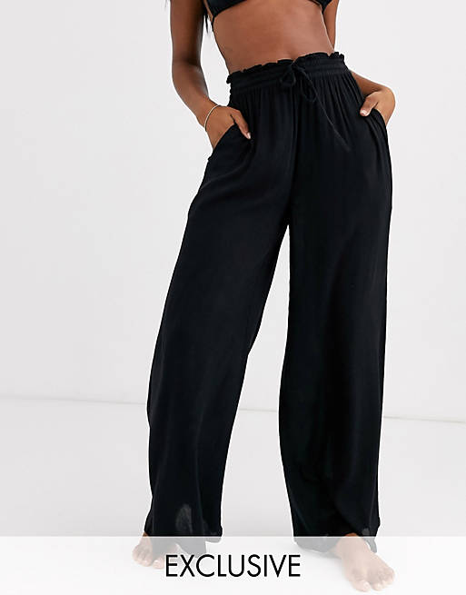 Iisla & Bird Exclusive drawstring beach pants in black | ASOS