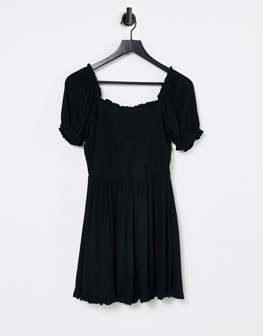 Iisla & Bird Exclusive mini shirred beach dress in black
