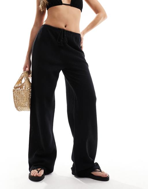 Iisla & Bird - Fijngebreide lange strandbroek met smalle taille in zwart