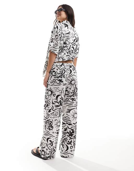 IIsla & bird graphic print loose fit beach trouser co-ord in white and black, 5 of 5