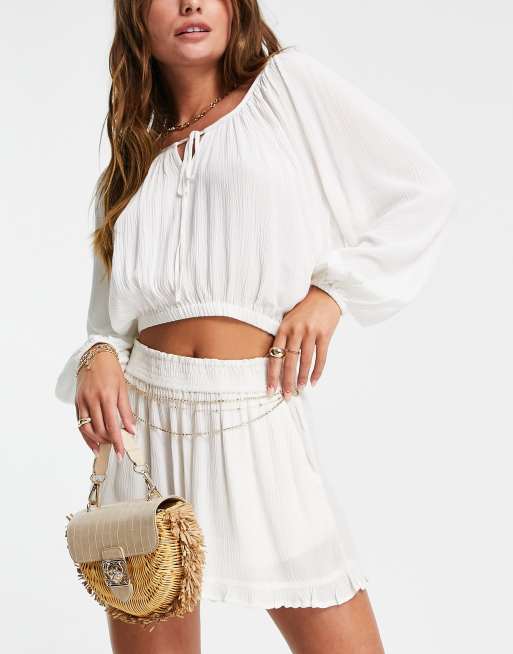 Iisla& Bird - Top grembiule da mare con maniche voluminose, color crema 