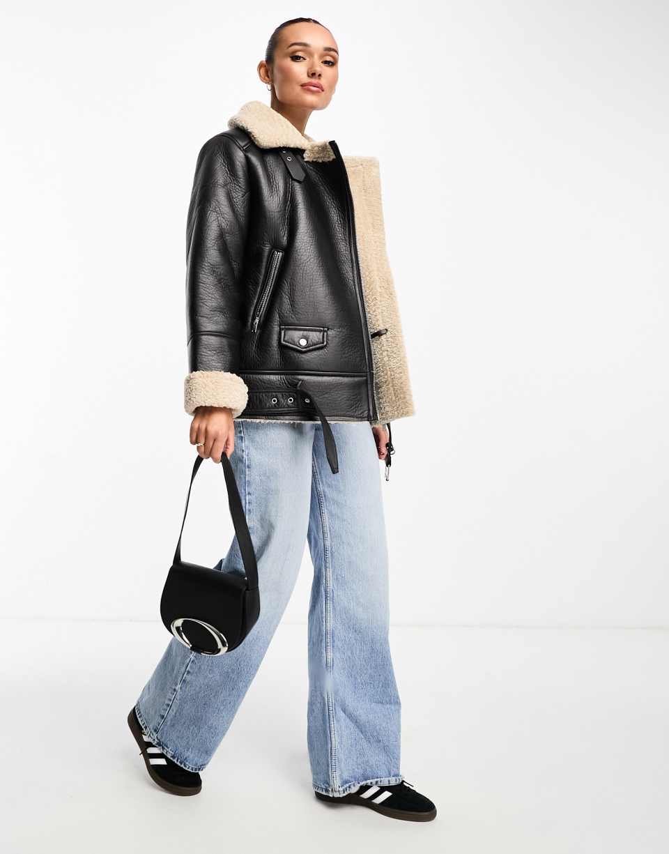 Black faux leather flare trousers