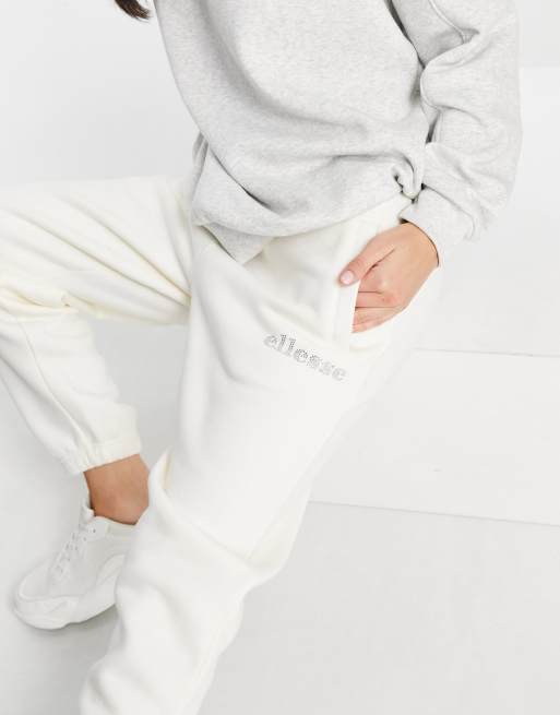 In esclusiva per ASOS - ellesse - Joggers con logo in strass, colore bianco sporco
